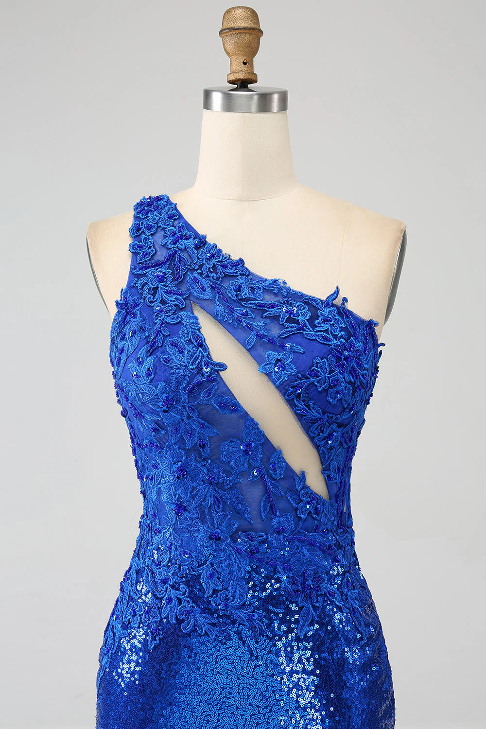 Mermaid style royal blue dress showcasing a side slit.