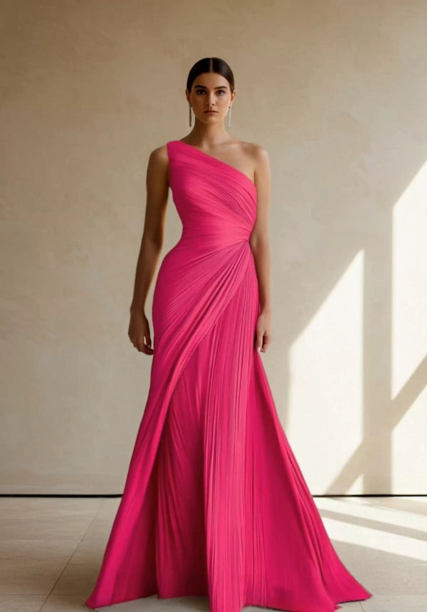 Side view of a woman in a stylish one-shoulder ruched formal dress.