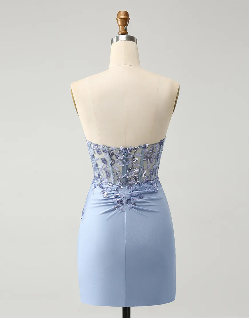 Side view of a woman in a sequined corset maxi formal gown.