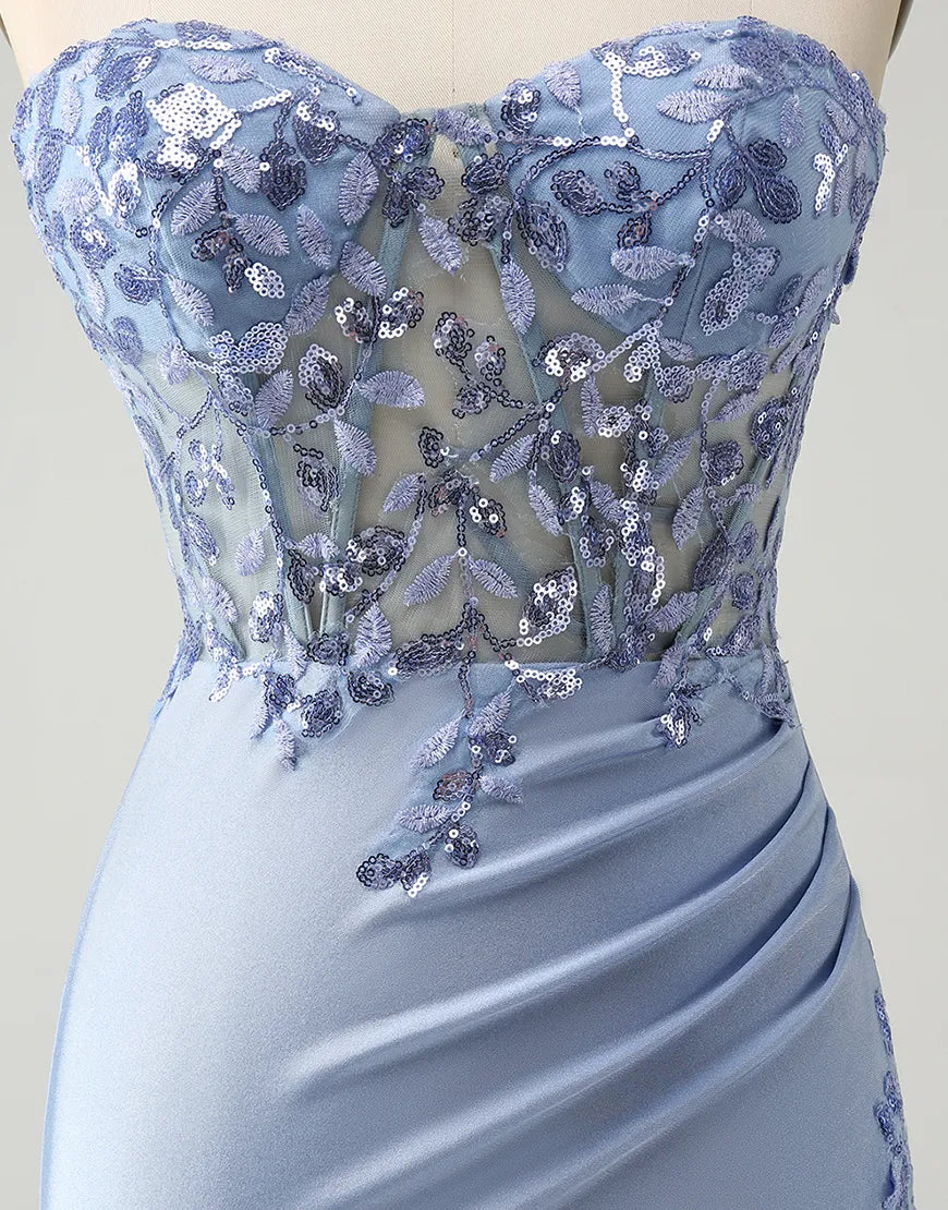 Back view of a sequined corset maxi gown, showing lace-up detail.