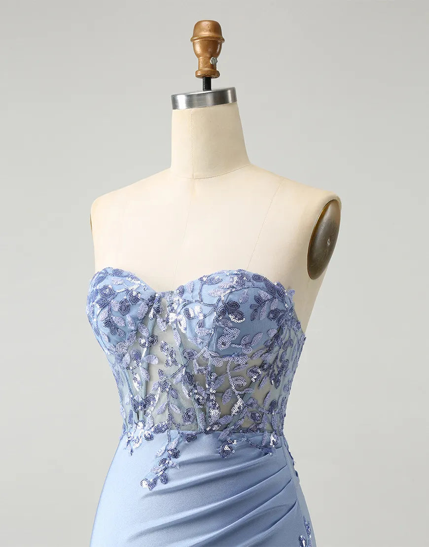 Close-up of intricate sequined appliques on the corset bodice.