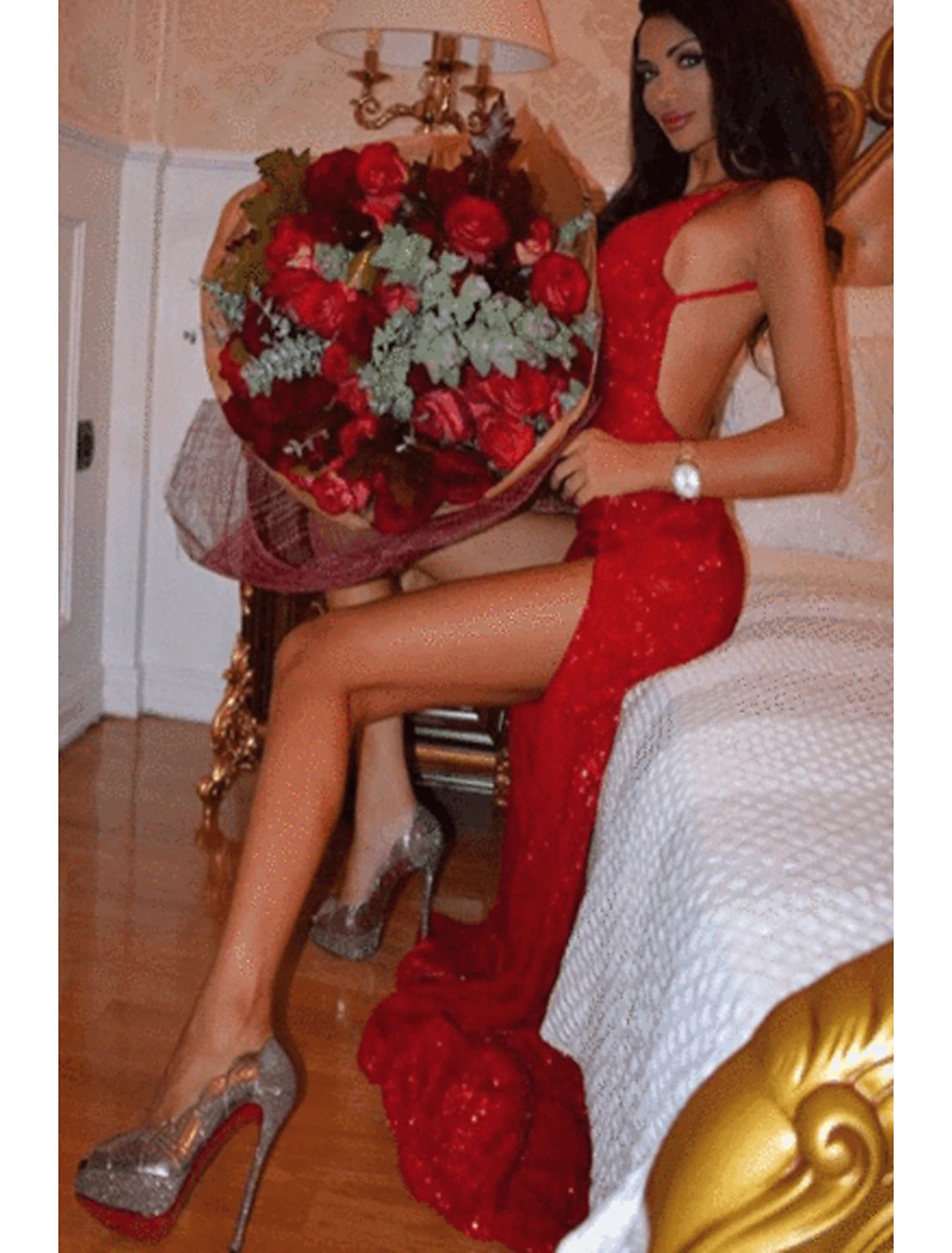Back view of a woman wearing a strapless sequined trumpet gown.