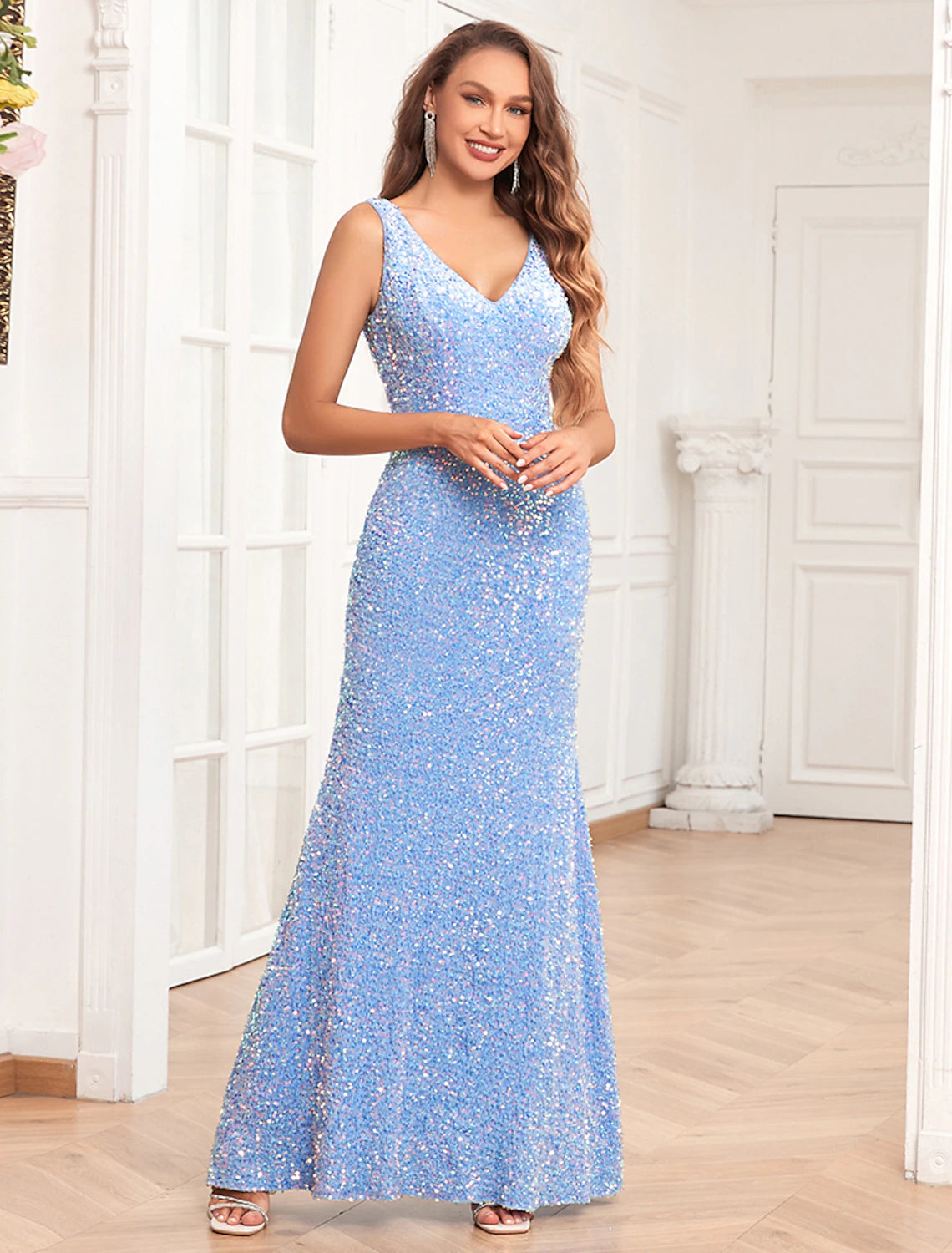 Glamorous sequined mermaid trumpet evening gown with V-neck and floor-length design.