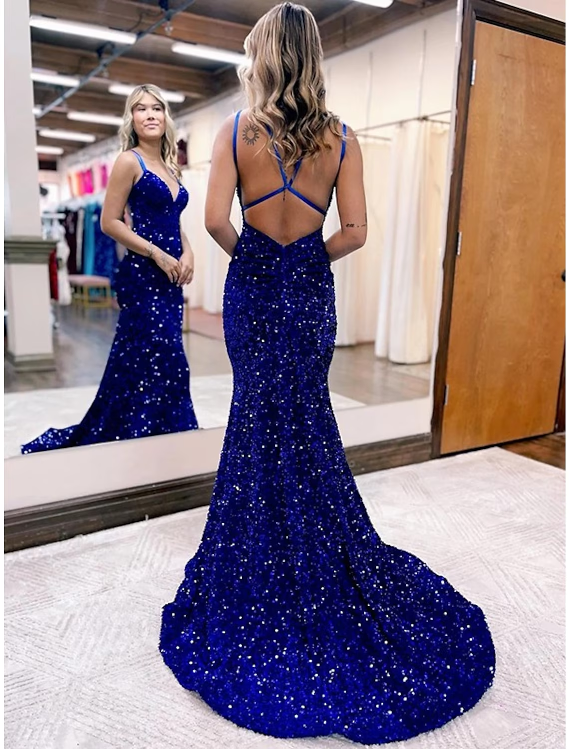 Close-up of the dark velvet and sequin fabric on a formal dress.