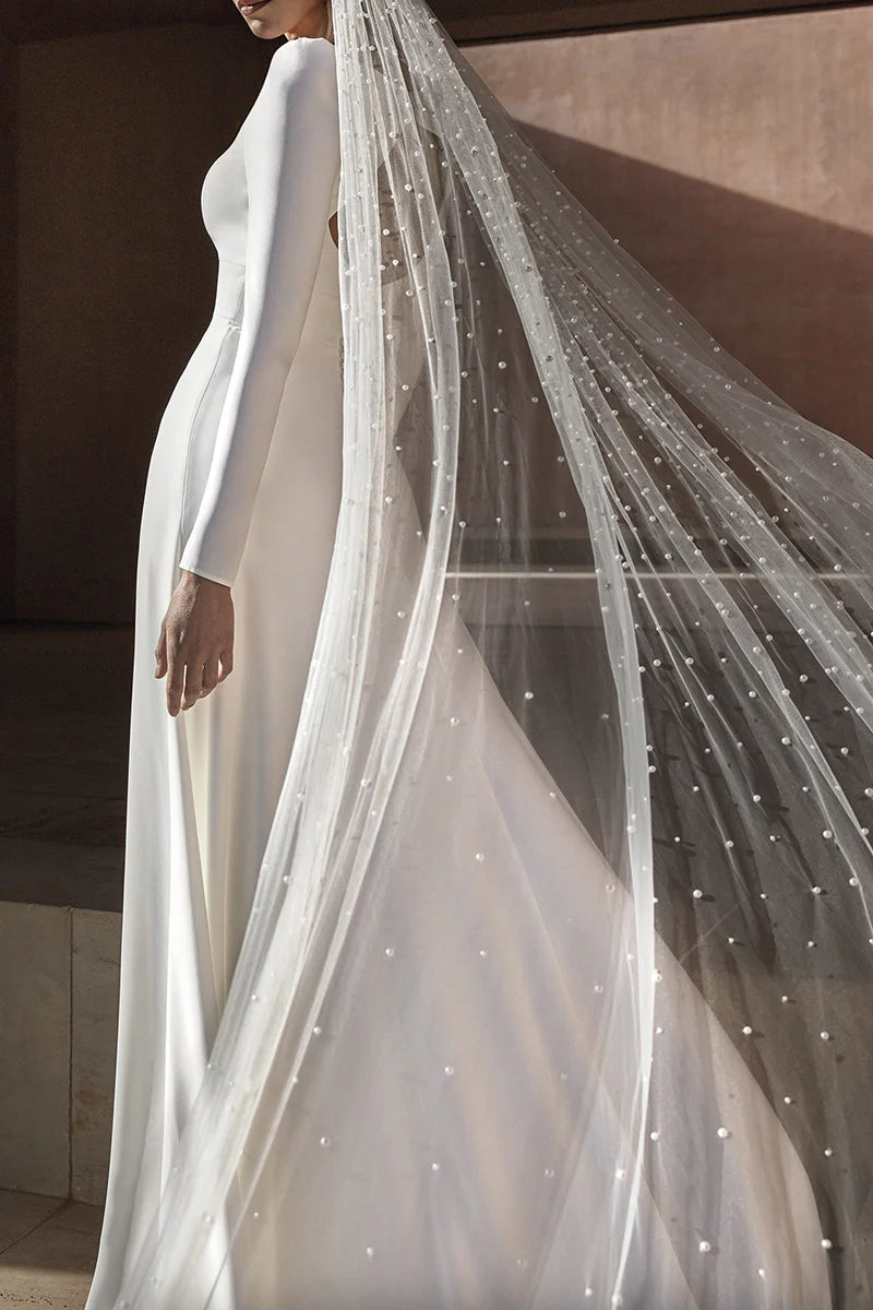 V-neck sparkly bridal dress with a flowing A-line skirt and side slit.