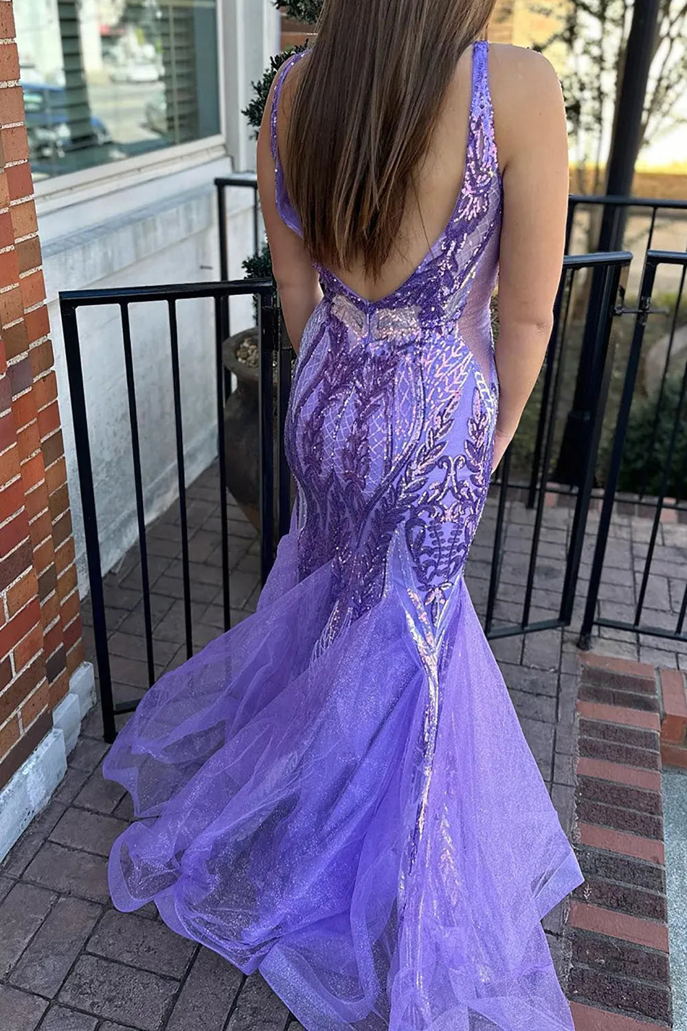 Mermaid formal gown, side view, showcasing sequin detail.