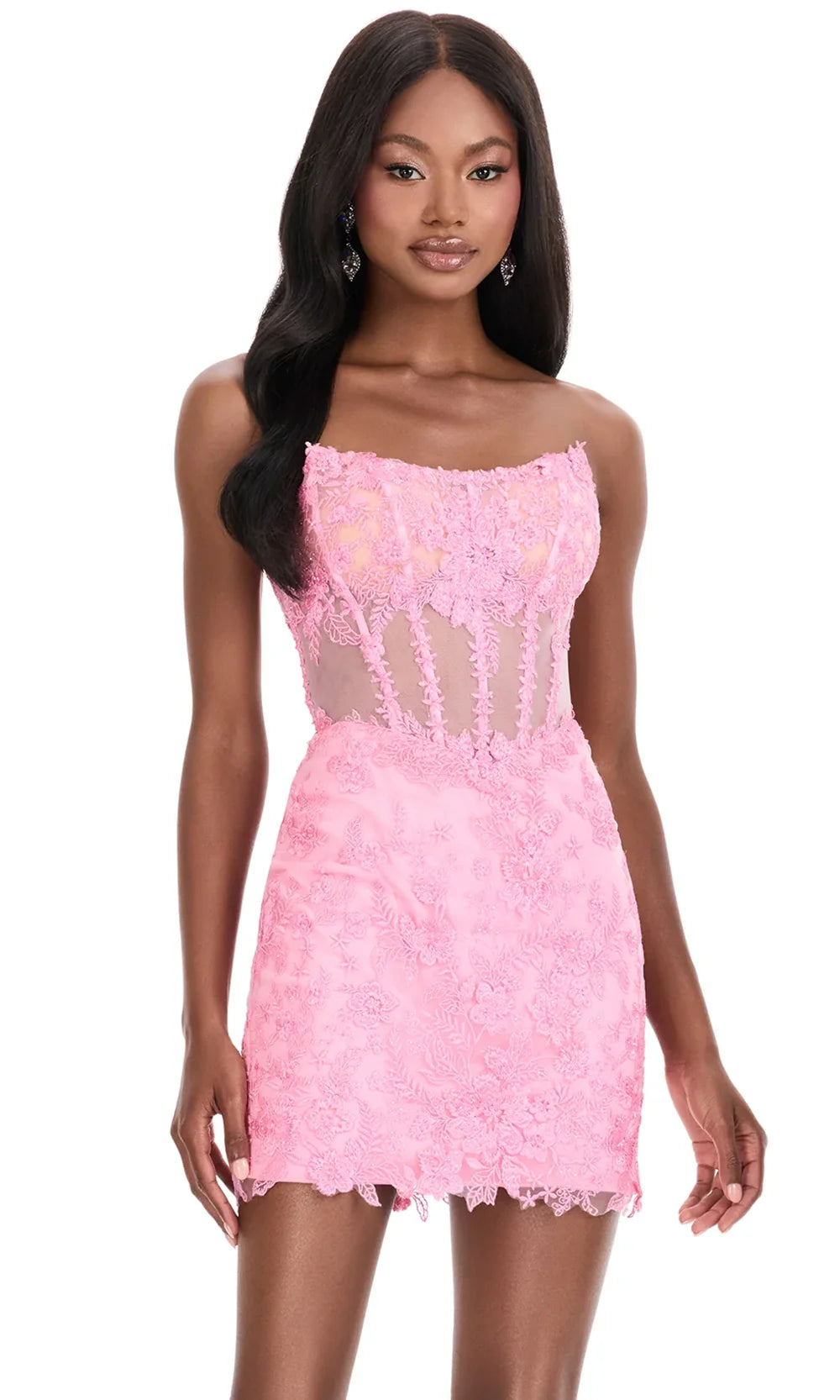 Pink strapless bodycon mini homecoming dress with sheer corset and floral lace details.