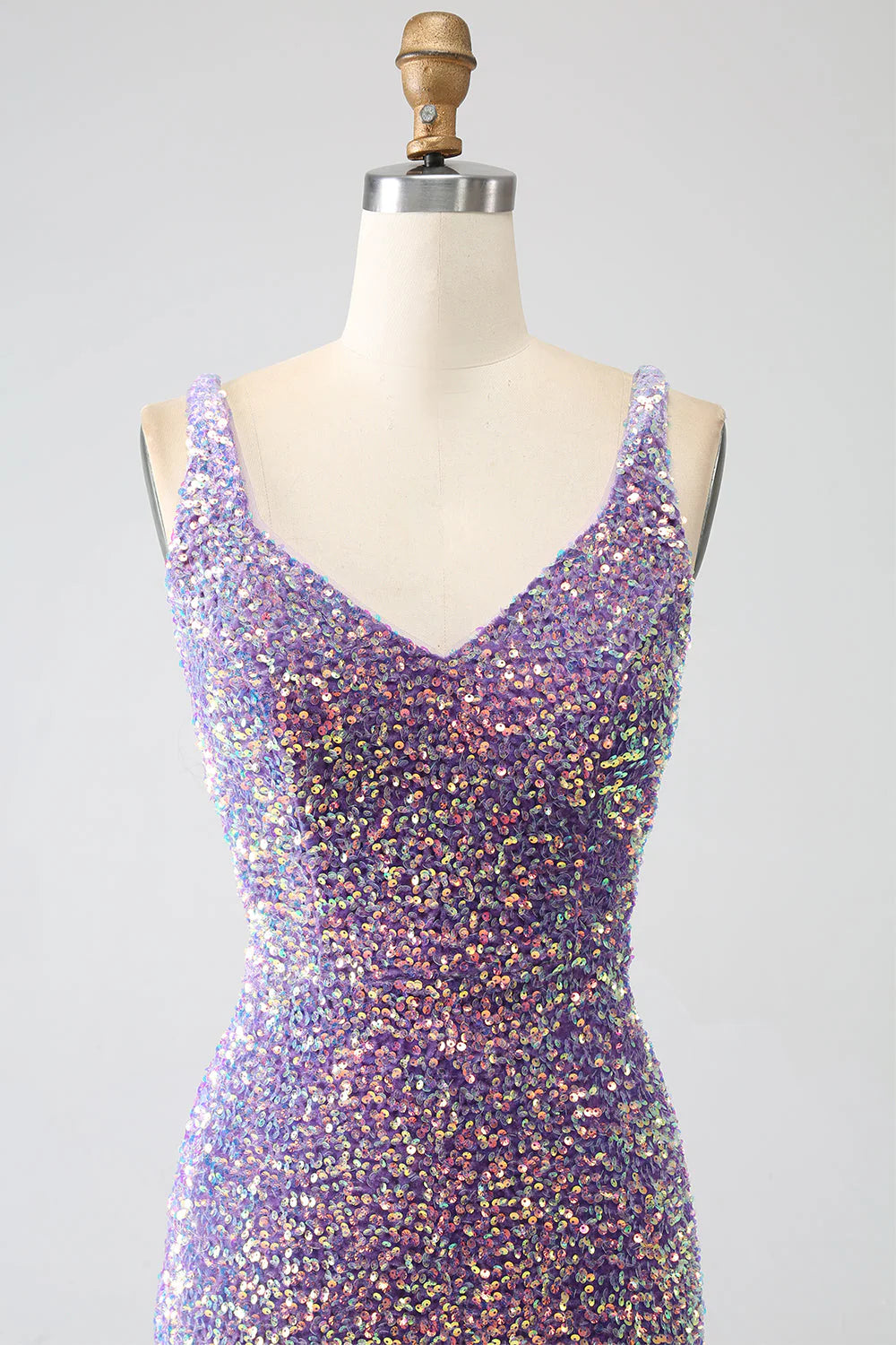 Close-up of the sequined fabric and sweetheart neckline on the light purple prom dress.