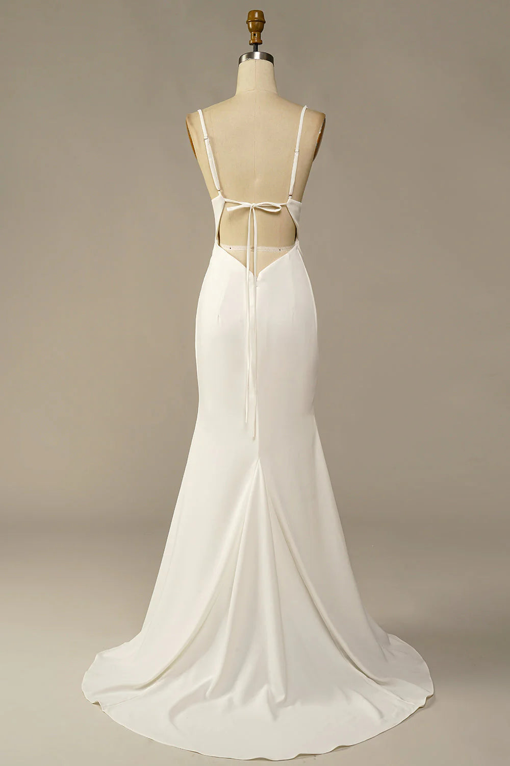 Back view of a white mermaid wedding dress with a chapel train.