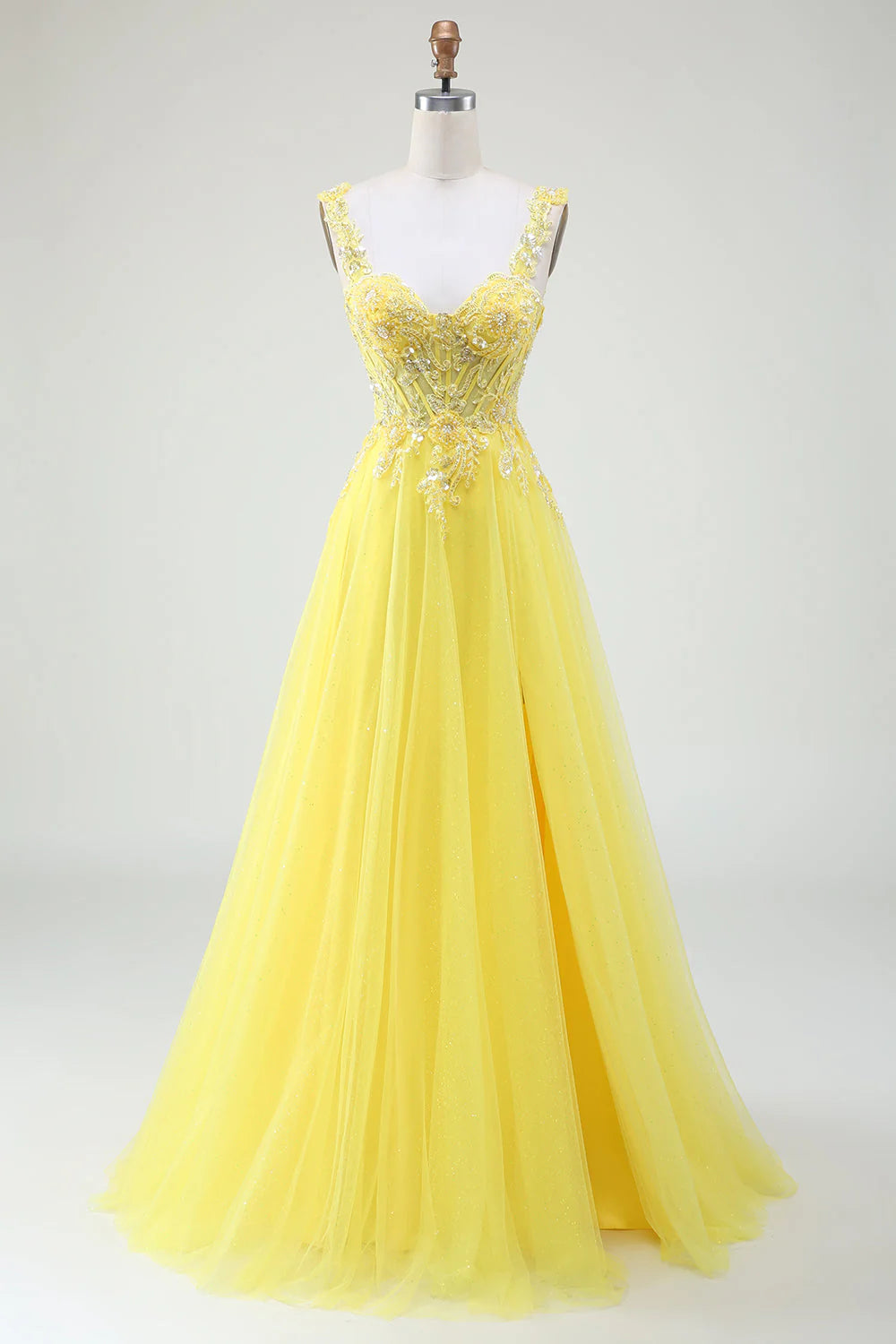 Yellow tulle beaded corset prom dress with a high slit.