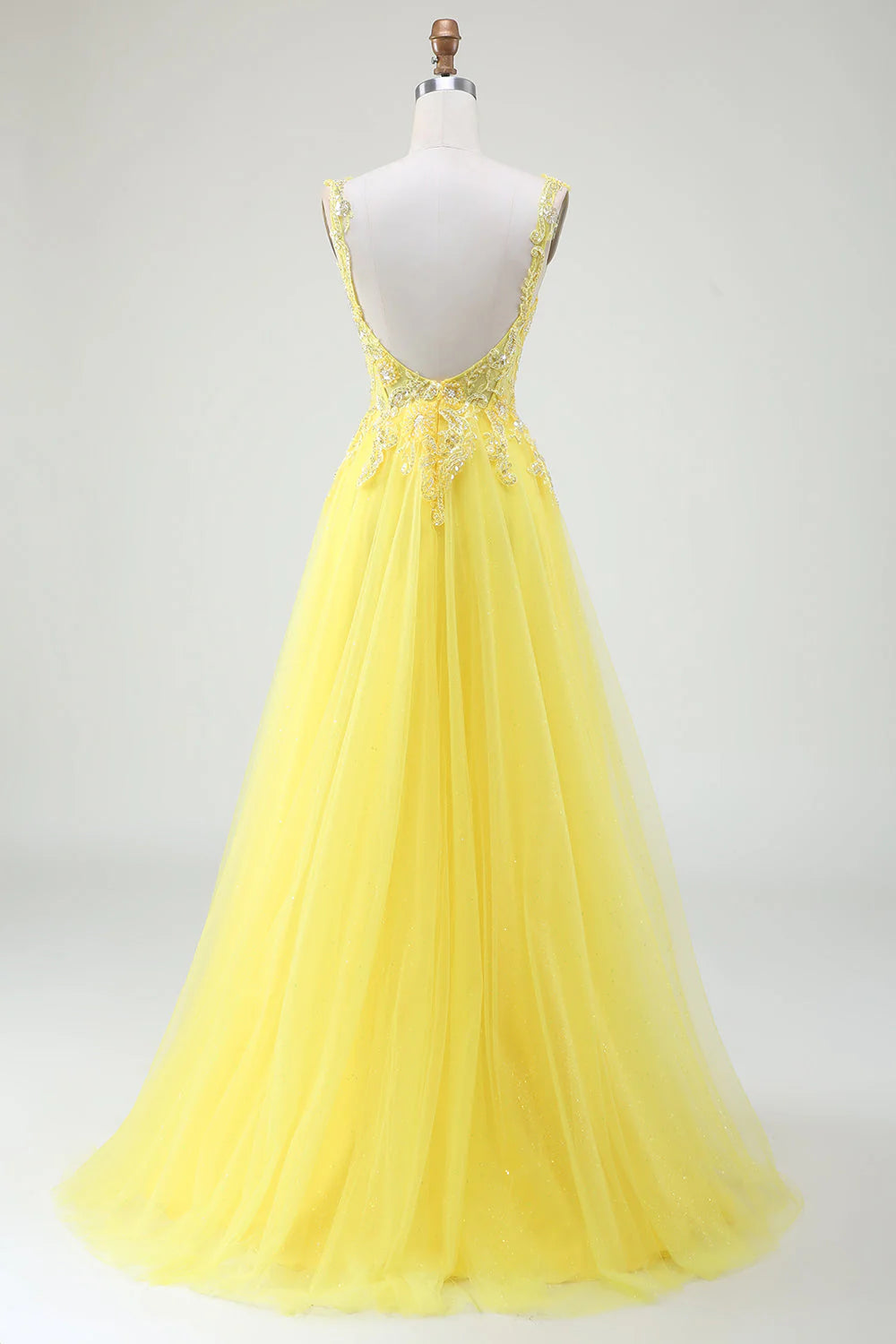 Back view of the yellow tulle prom dress, showcasing the corset detailing.