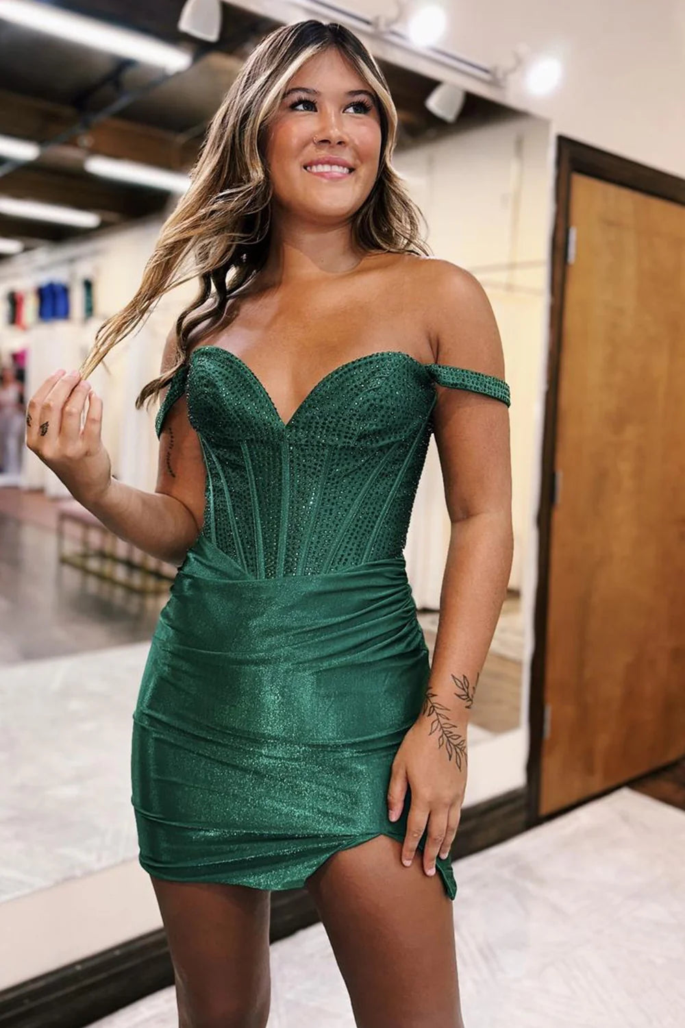 Side view of the tight-fit glitter off-shoulder party dress.