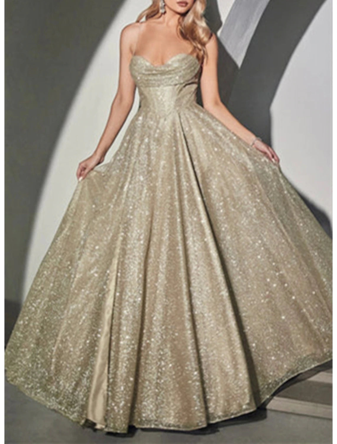 Back view of glittering A-Line prom dress with sweep train.
