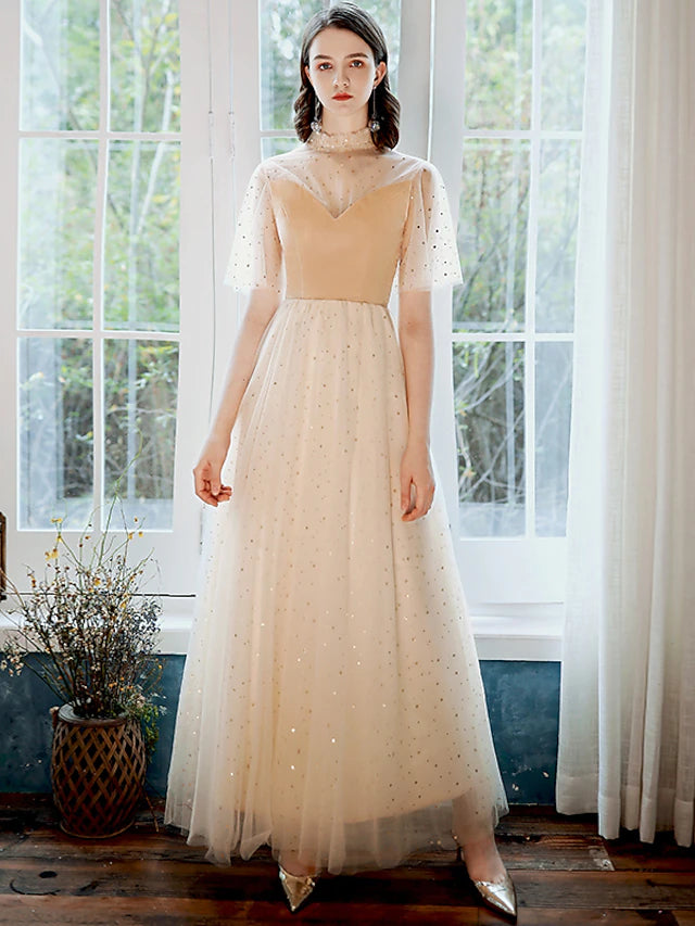 Front view of a model wearing a glittering A-line high neck half sleeve sequin tulle ankle length prom dress.