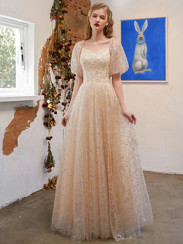 Glittering A-line prom dress with scoop neck and short sleeves.