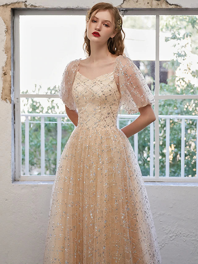 Side profile of an elegant A-line formal dress with pleats.