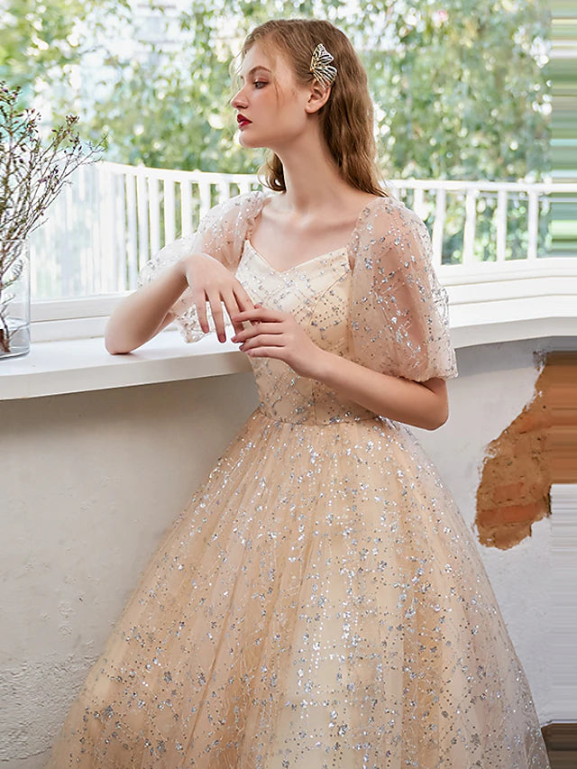 Close-up of the sequin and tulle fabric on a glittering dress.