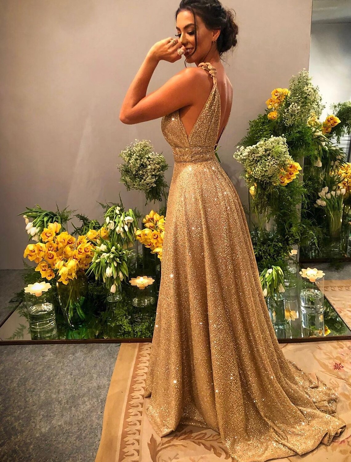 Back view of the elegant backless A-line dress, showcasing rhinestone details.