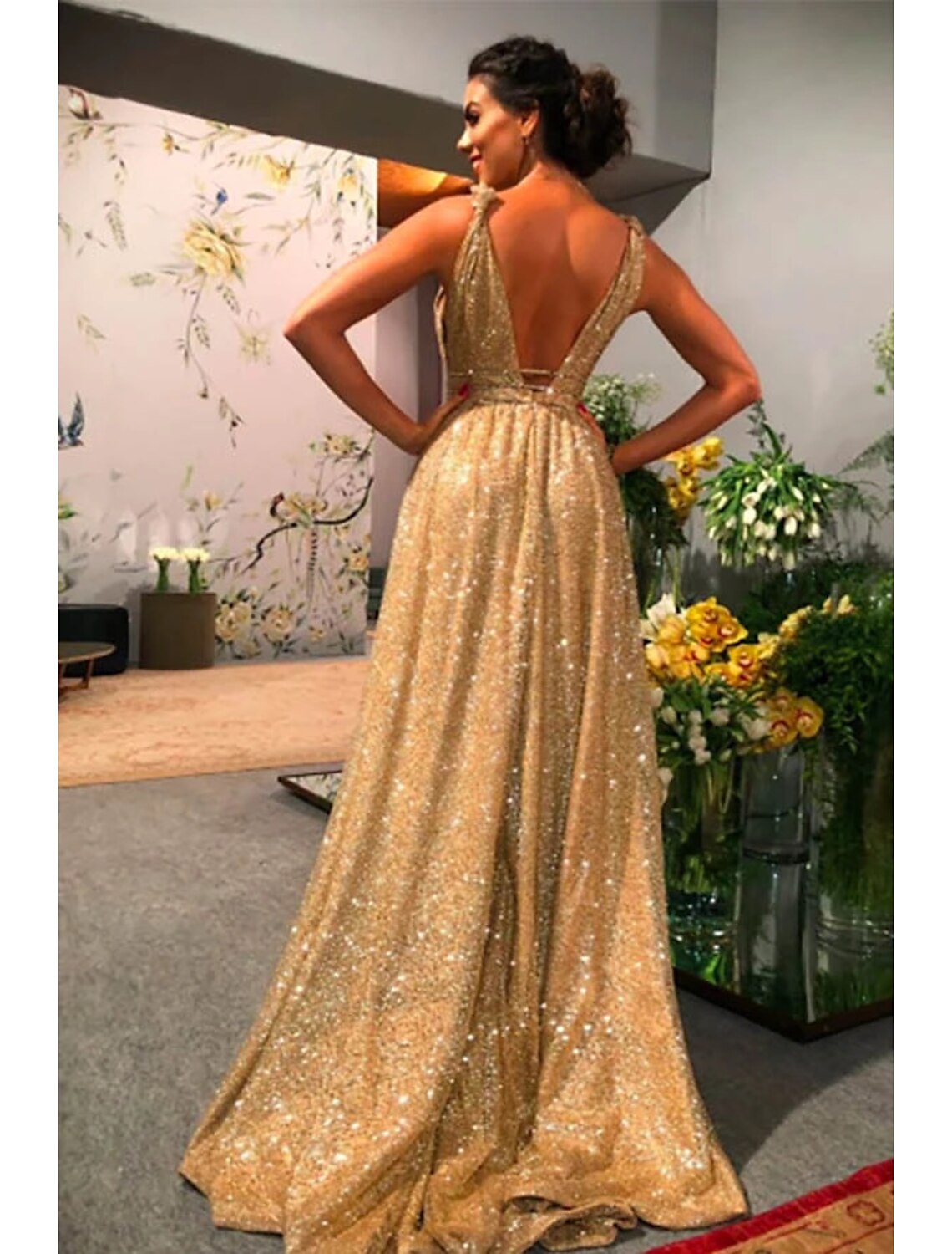 Close-up of the shimmering stretch satin fabric and intricate rhinestone embellishments.