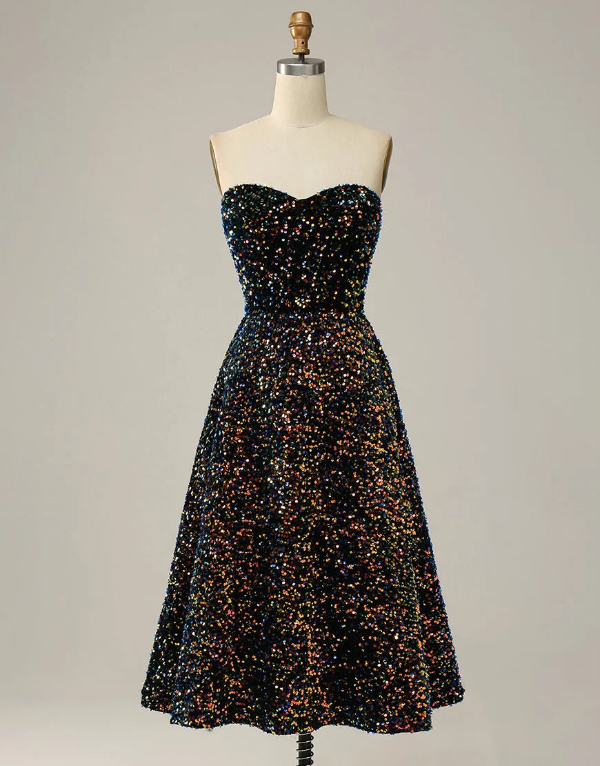 Black A-Line strapless glitter sequin tea length party dress on a model.