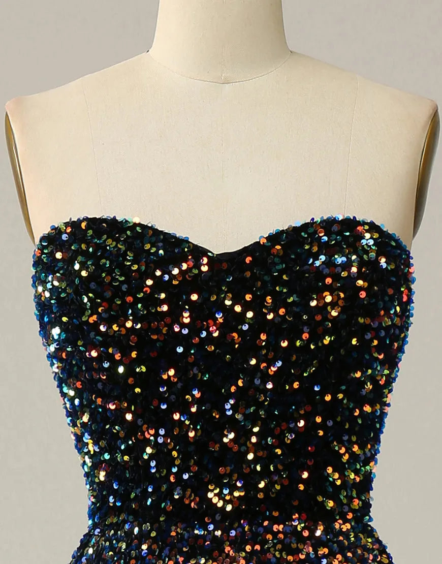 Model posing in a black A-Line strapless glitter sequin tea length party dress.