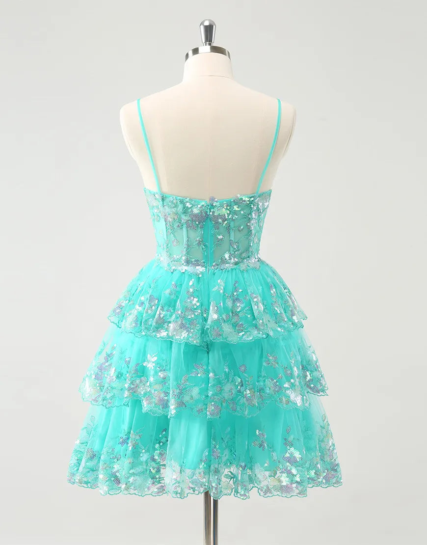 Close-up of the sequined bodice and tiered skirt of the A-line dress.