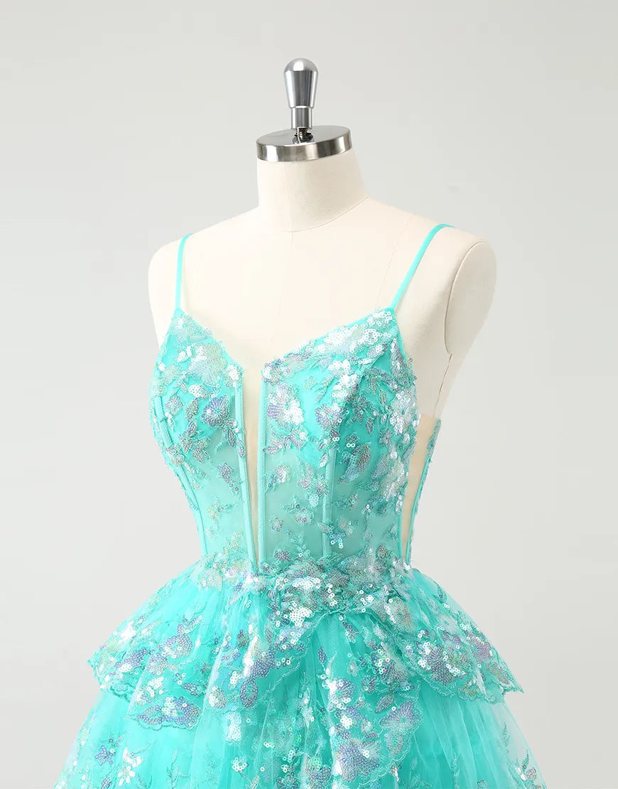 Back view of the A-line glitter tiered dress with spaghetti straps.