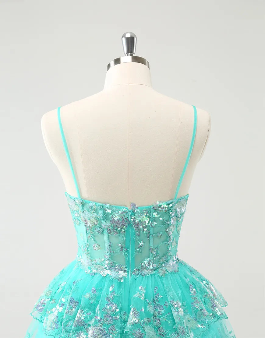 Side profile of a woman in the shimmering tiered sequined formal dress.