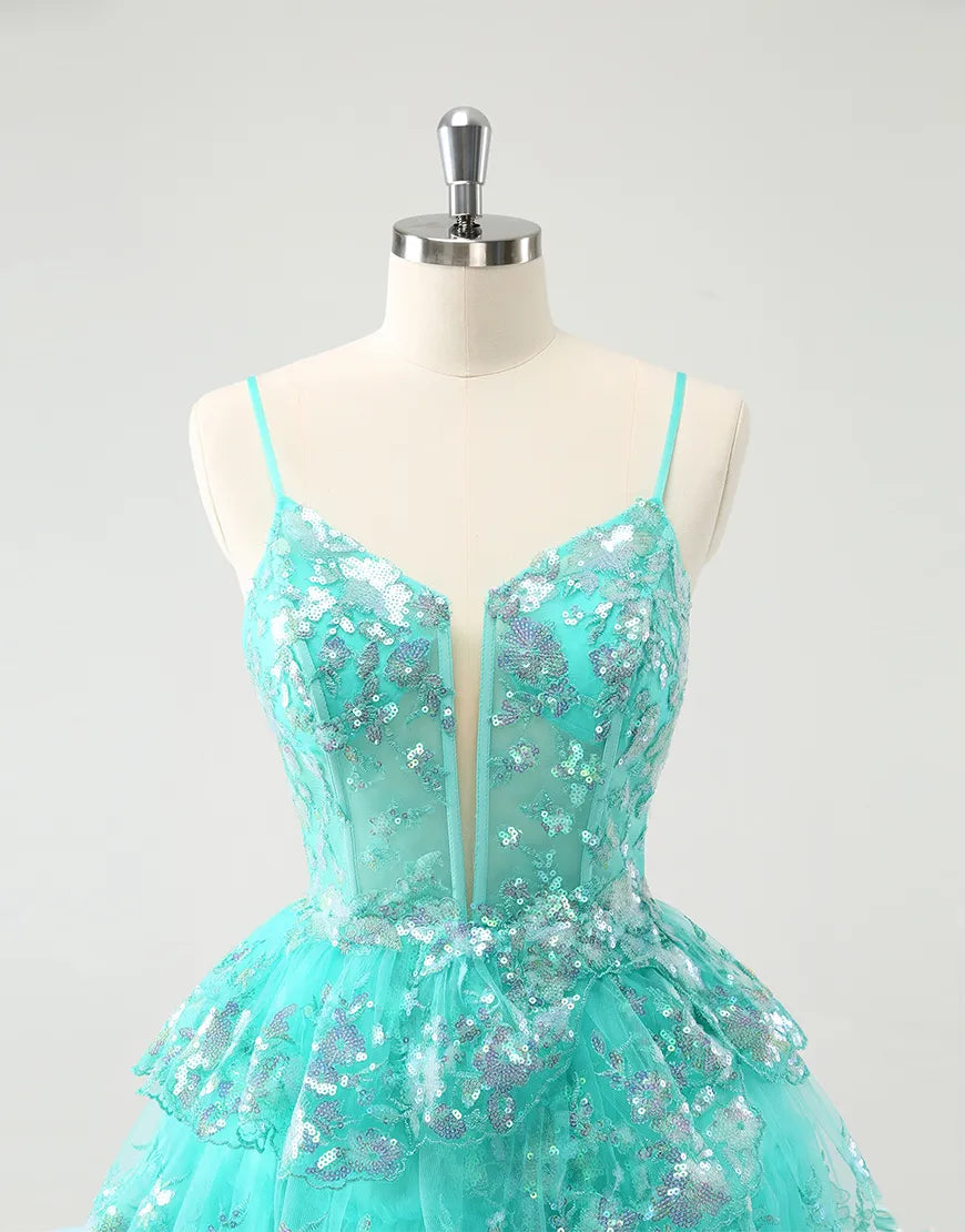 Detail of the glitter fabric and sequin embellishments on the dress.