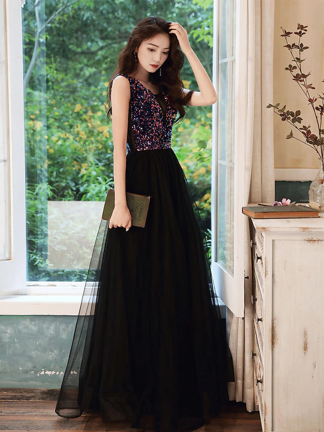 Back view of the sequined A-line dress with a flowing skirt.