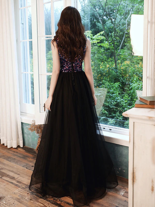 Model posing in the shimmering A-line V-neck formal dress.