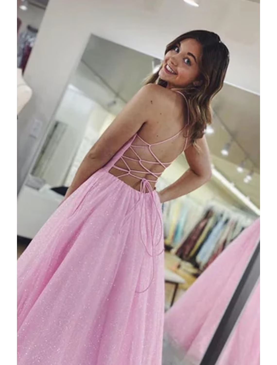 Back view of the glittering A-line V-neck tulle ball gown with pleats.