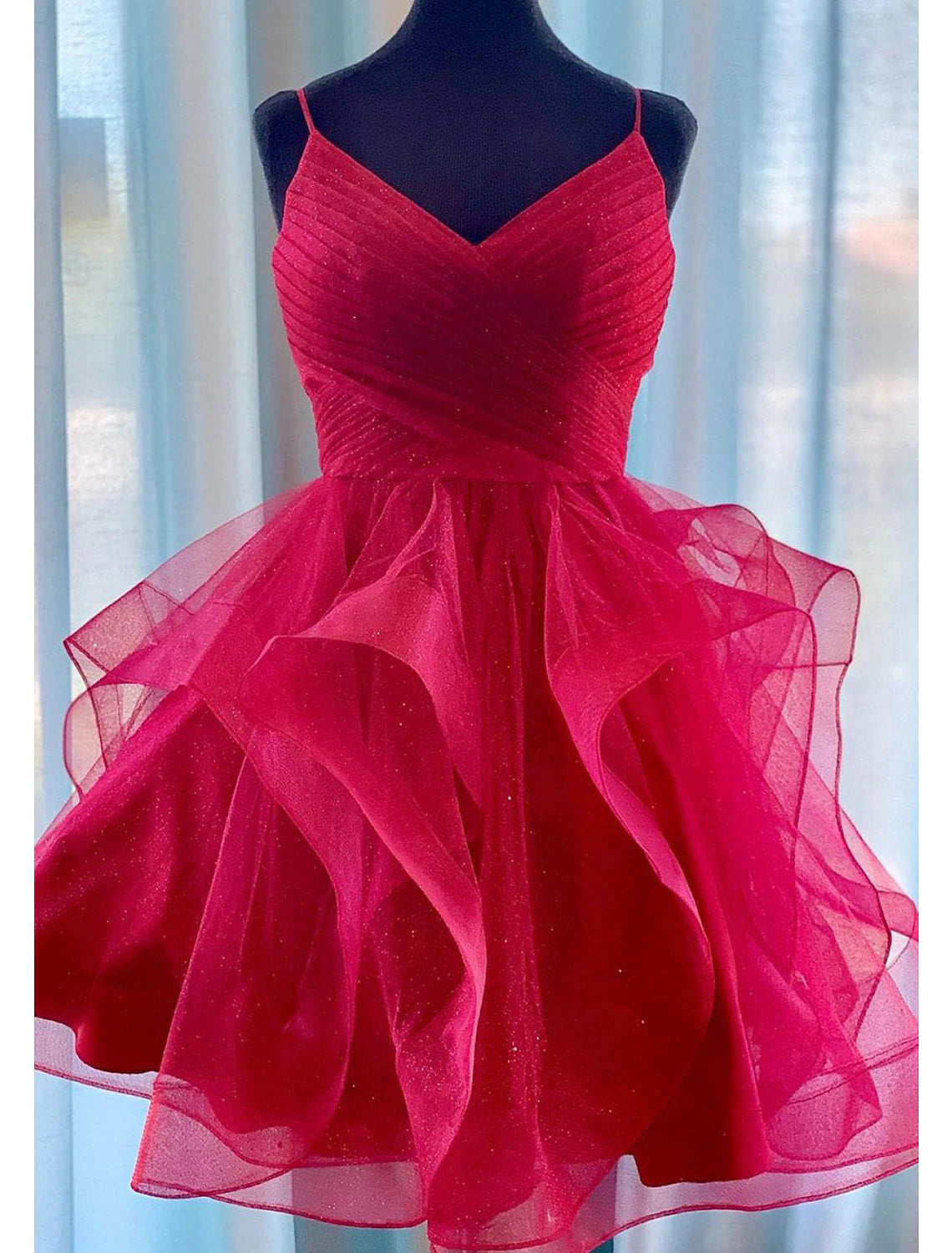 Back view of the puff tiered tulle mini dress with spaghetti straps.