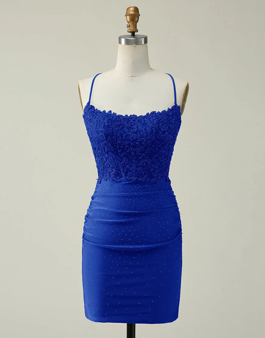 Model wearing a glittering short homecoming dress with lace top and spaghetti straps.