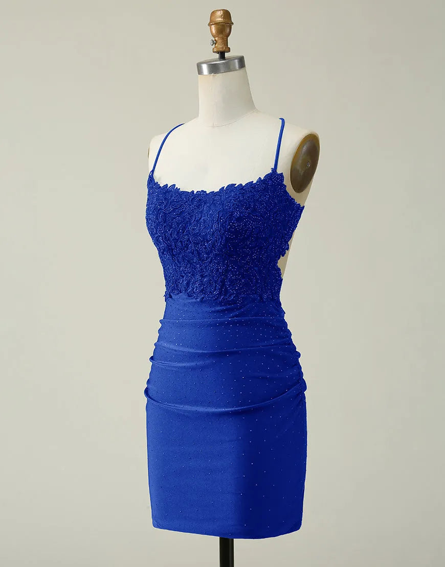 Side profile of a shimmering short homecoming dress with spaghetti straps.