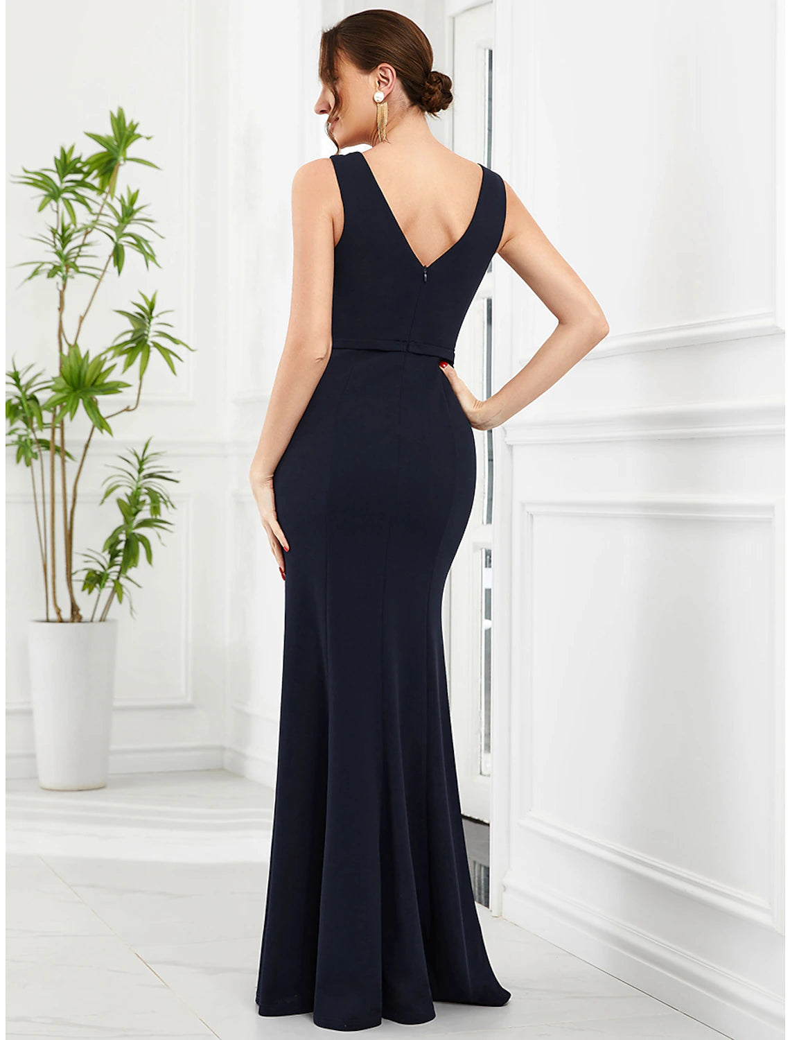 Side view of the glittering mermaid trumpet gown, highlighting the floor-length silhouette.