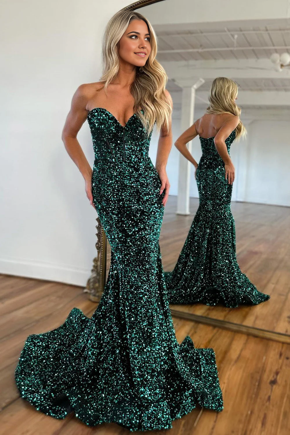 Model wearing a dark green glitter sequin mermaid prom dress with a sweetheart neckline.
