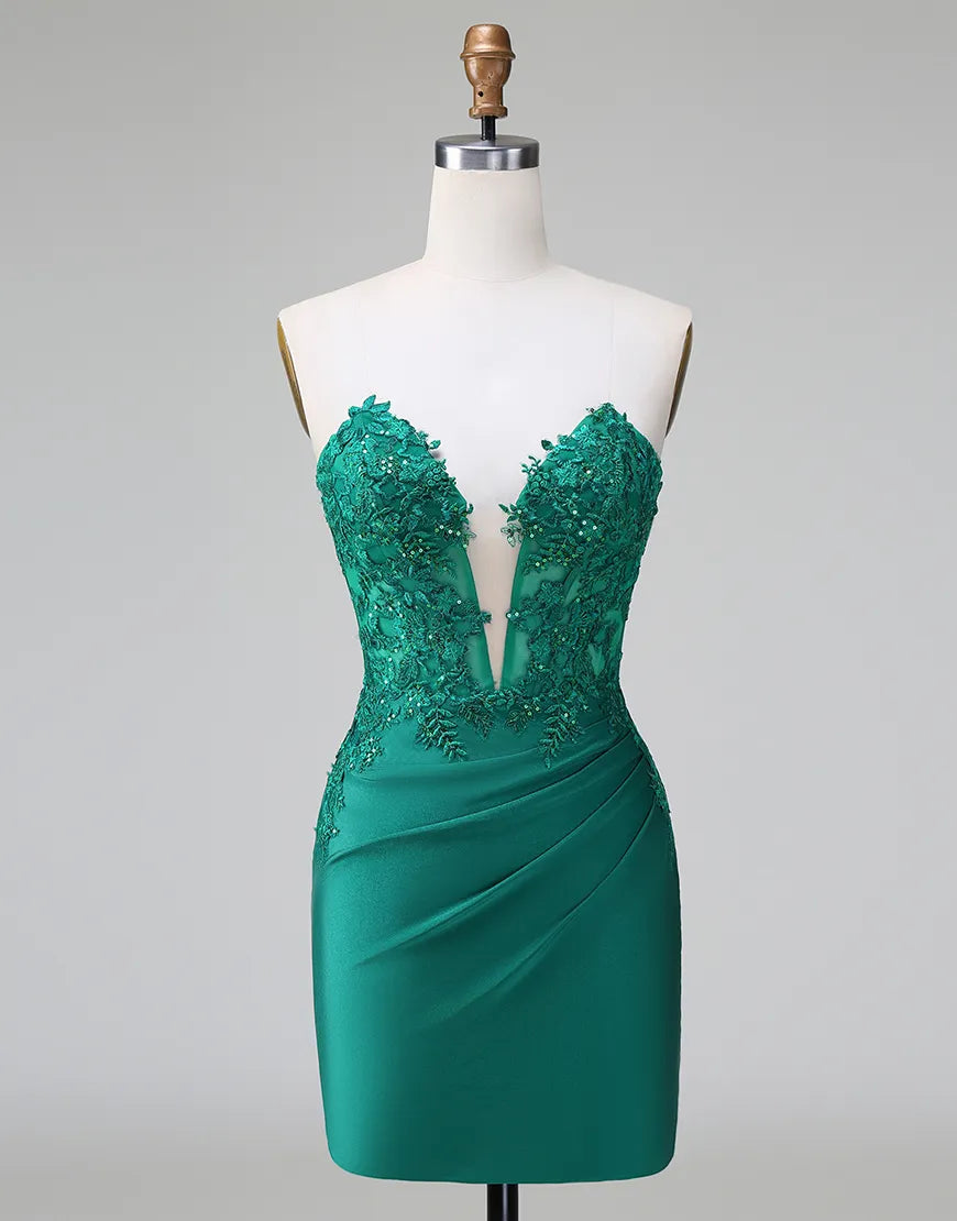 Model wearing a glittering green sheath maxi dress with V-neck and beaded appliques.