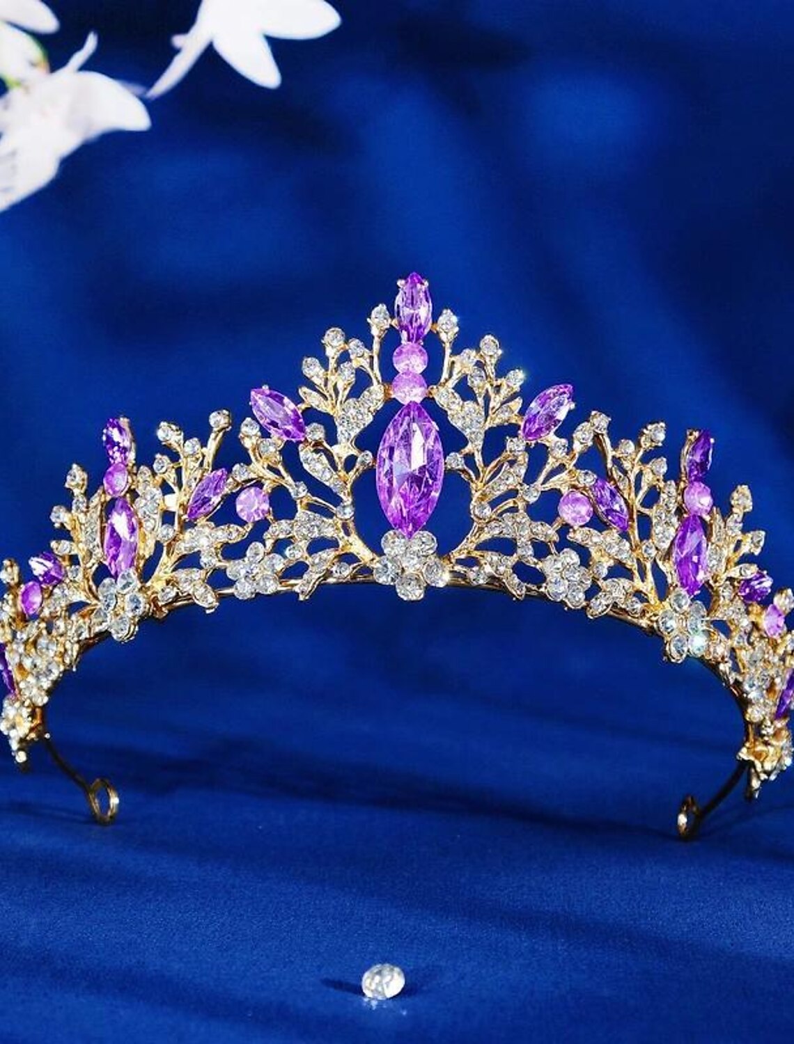 Woman wearing a golden crystal wedding tiara.