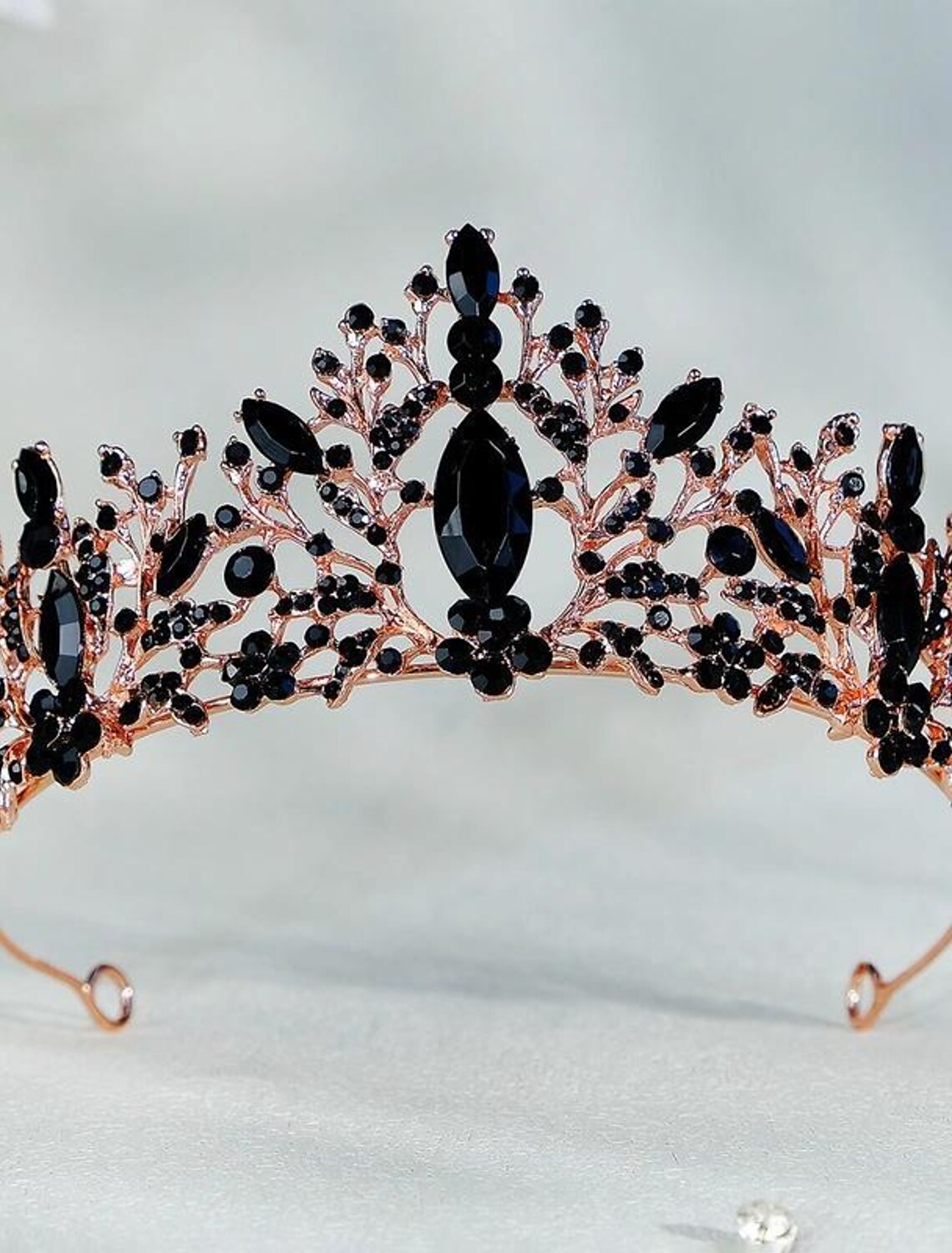 Golden crystal tiara crown from a side view.