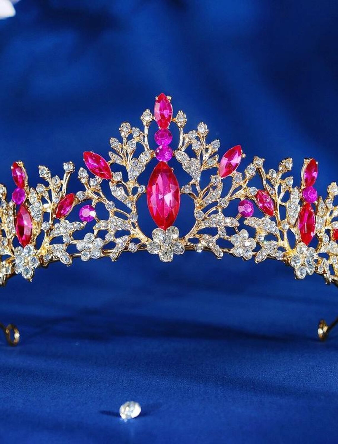 Golden crystal tiara crown with sparkling elements.