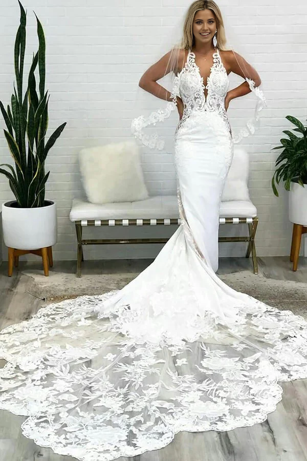 Elegant mermaid wedding dress with deep V-neck and lace details, viewed from the front.