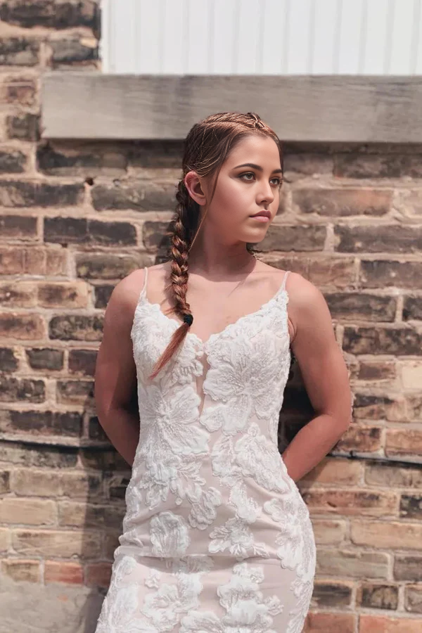 Full view of a mermaid wedding dress with V-neck and spaghetti straps.