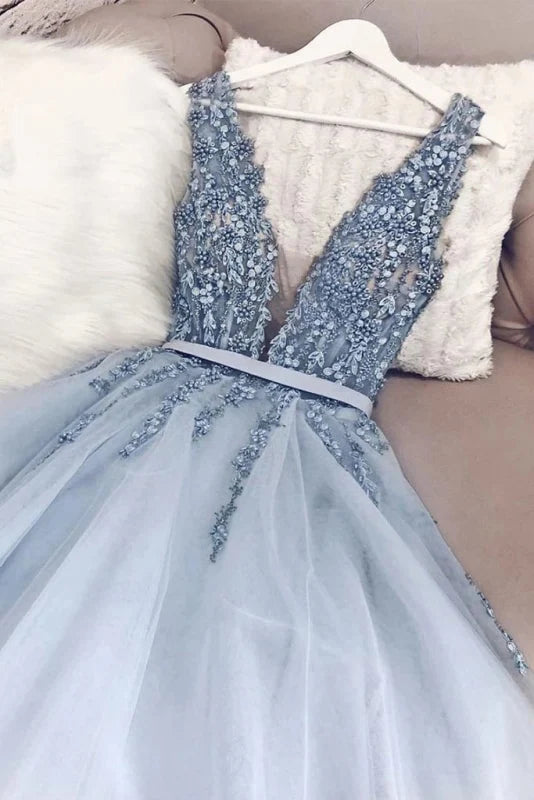 Back view of a model showcasing the elegant backless design of the long prom dress.