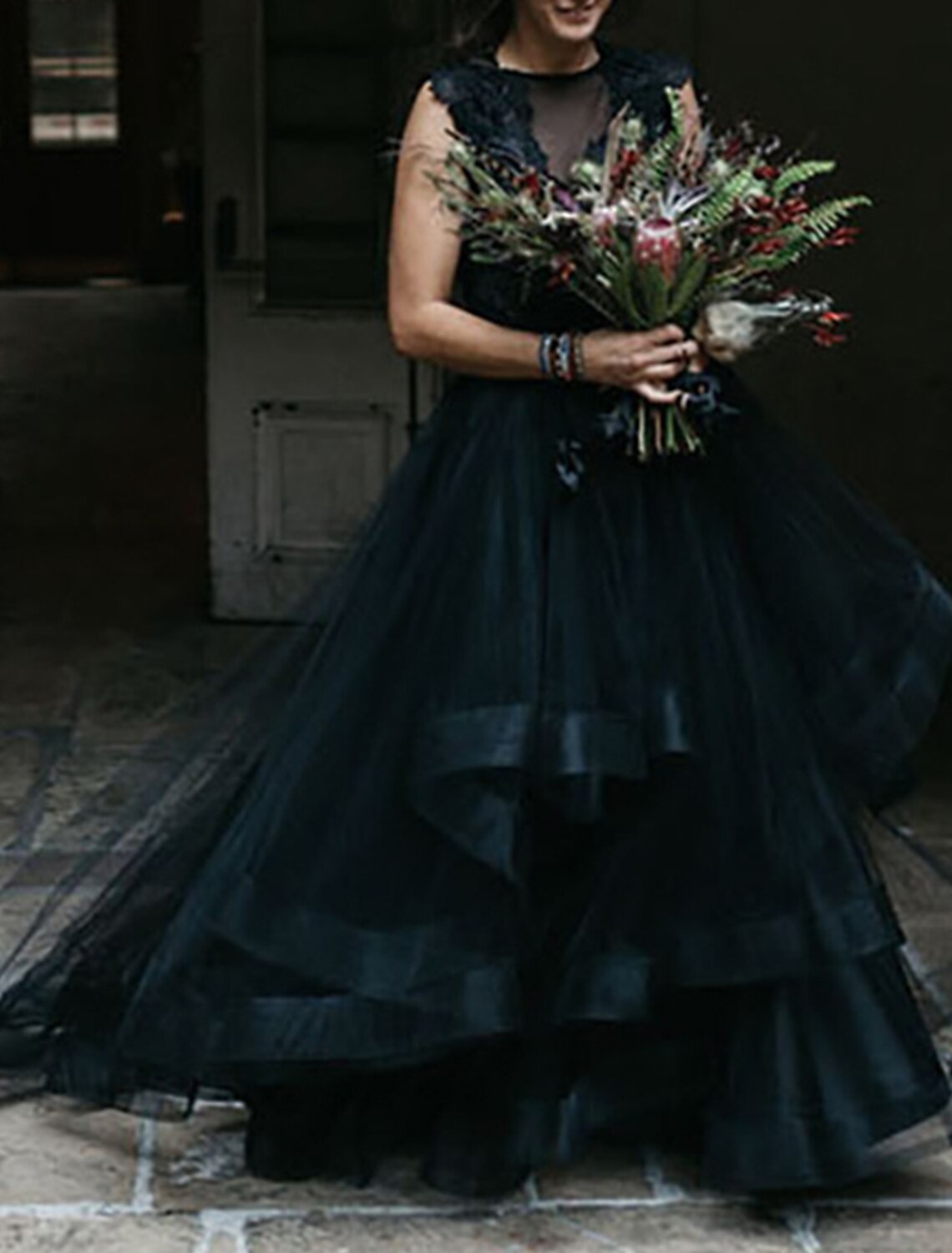 Back view of Gothic wedding dress showing cascading ruffles and sweep train.