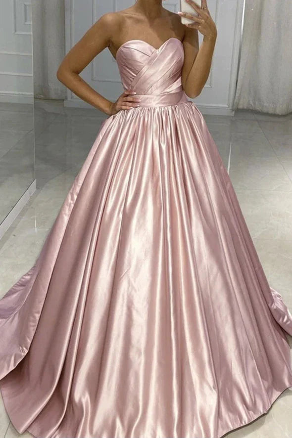 Close-up of the satin fabric and sweetheart neckline of the prom dress.