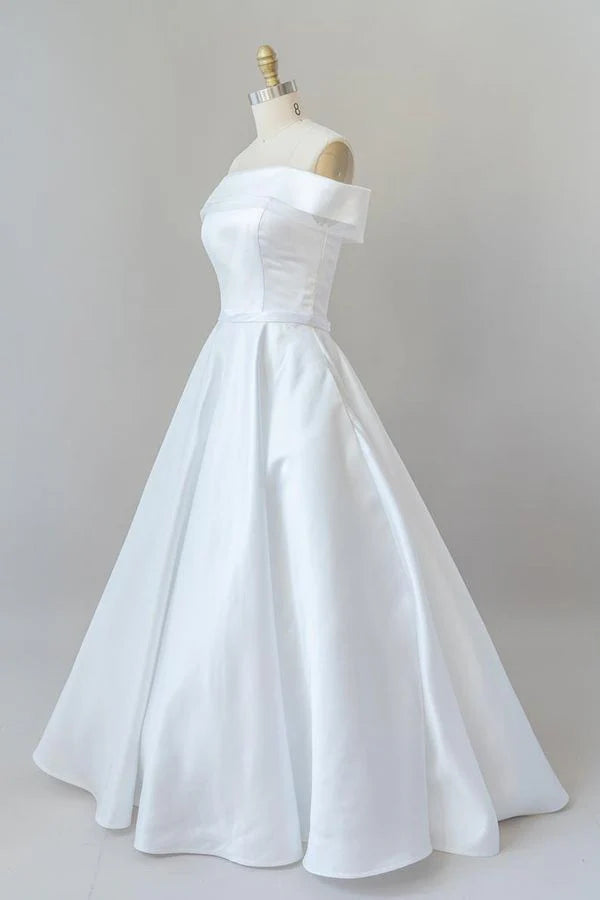 Side profile of the A-line off-shoulder satin wedding dress.