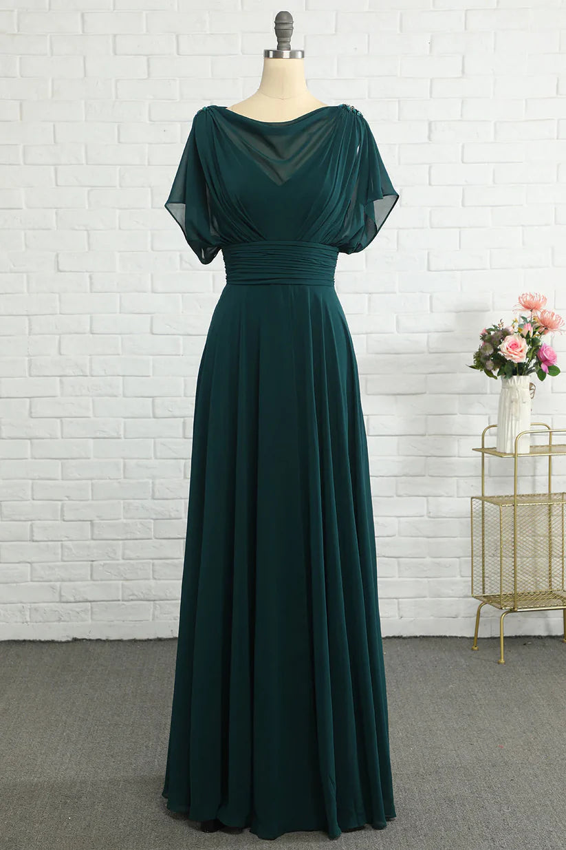 Woman wearing an elegant A-line V-neck chiffon Mother of the Bride dress.