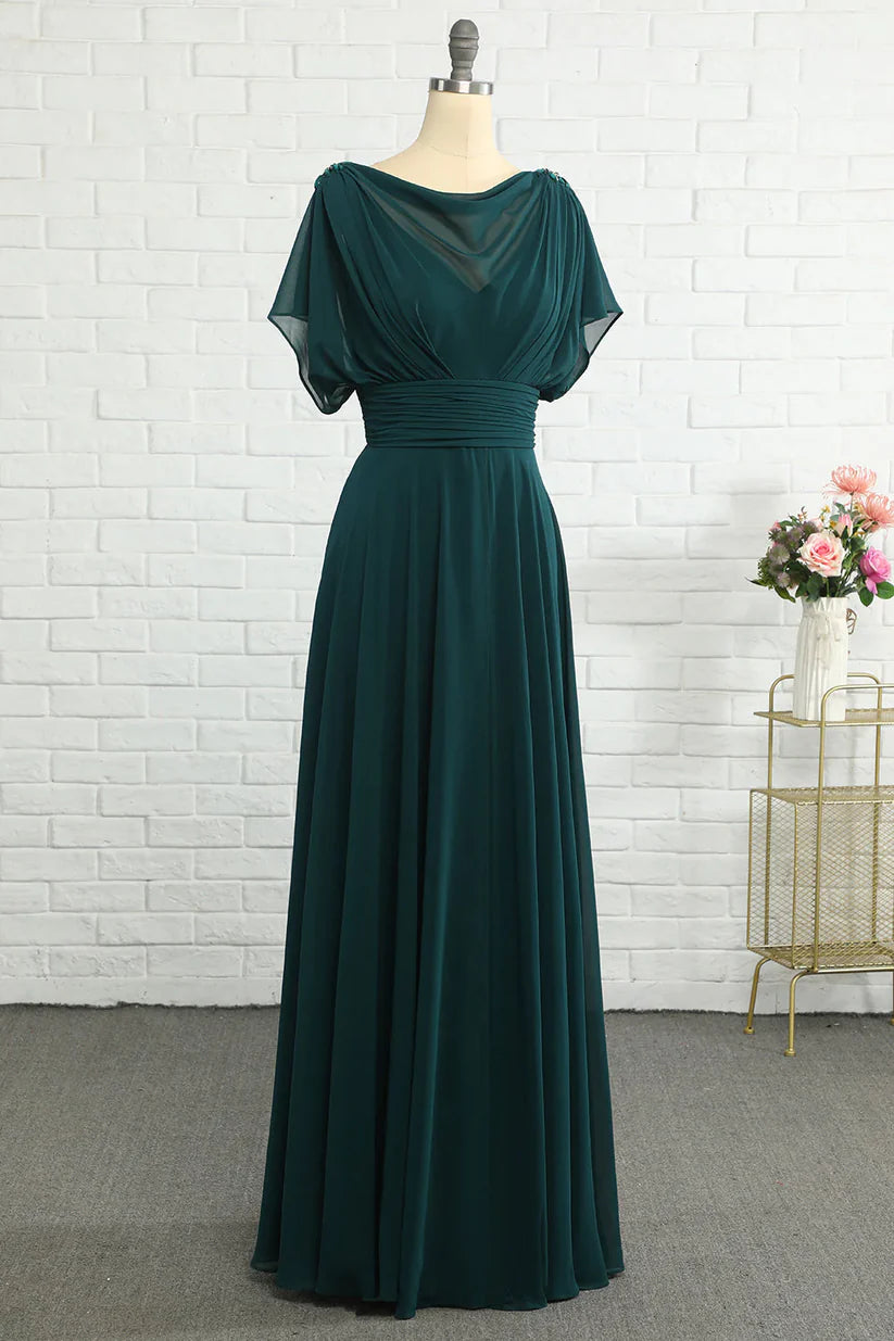 Side view of a woman in an elegant sleeveless A-line dress.