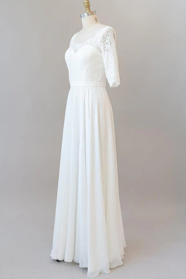 Full length view of the long sleeve A-line wedding dress.